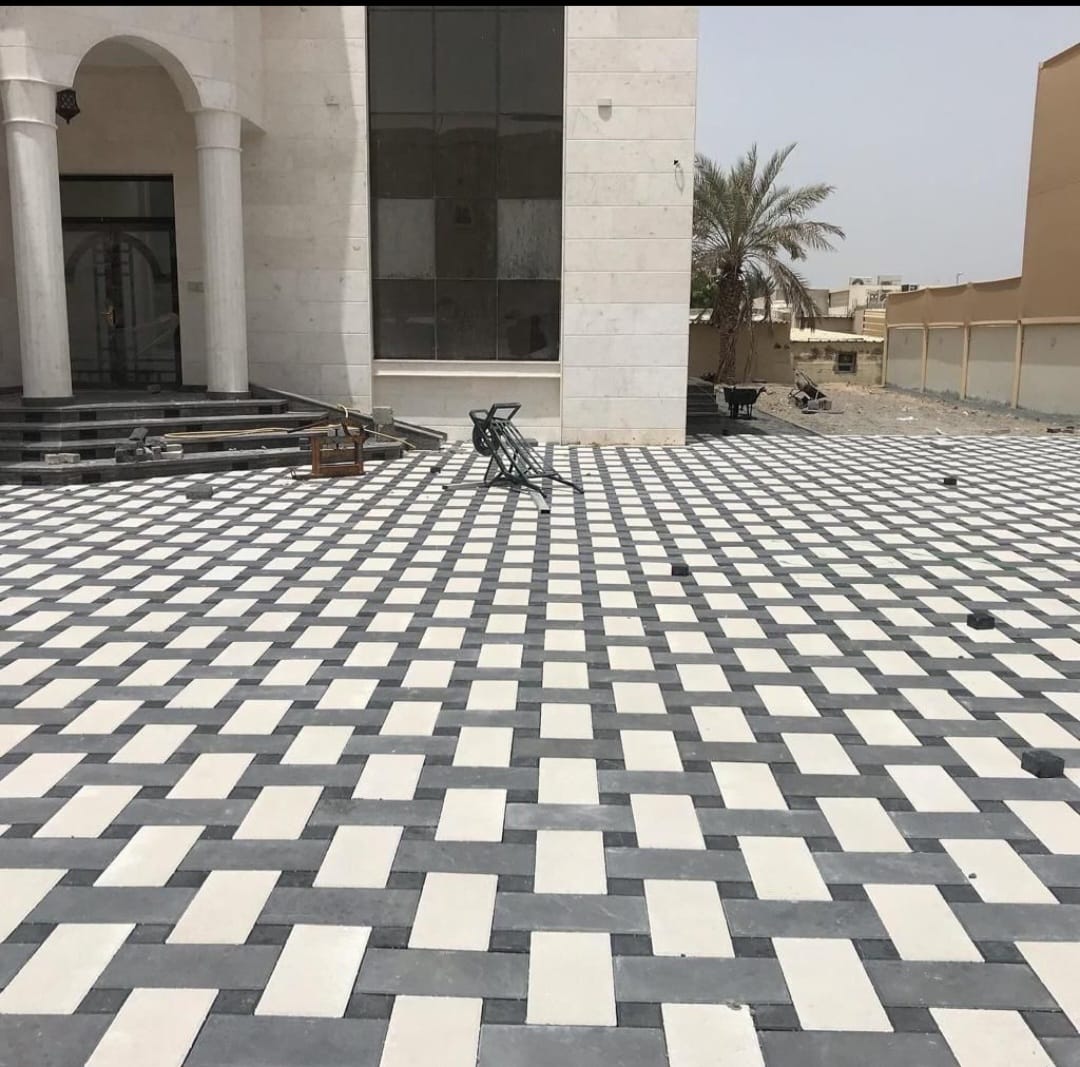 Black and white interlock courtyard at a mansion, Abu Dhabi